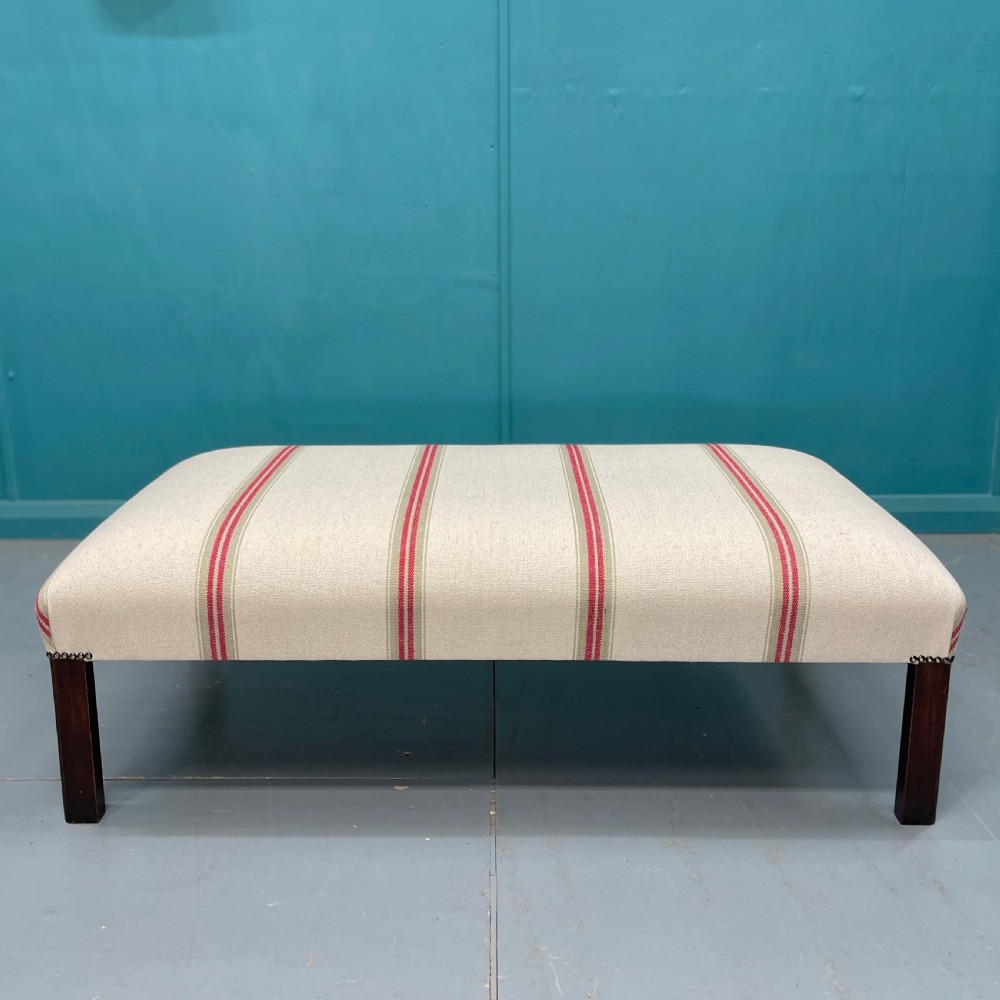 Newly upholstered heavy ticking stripe footstool