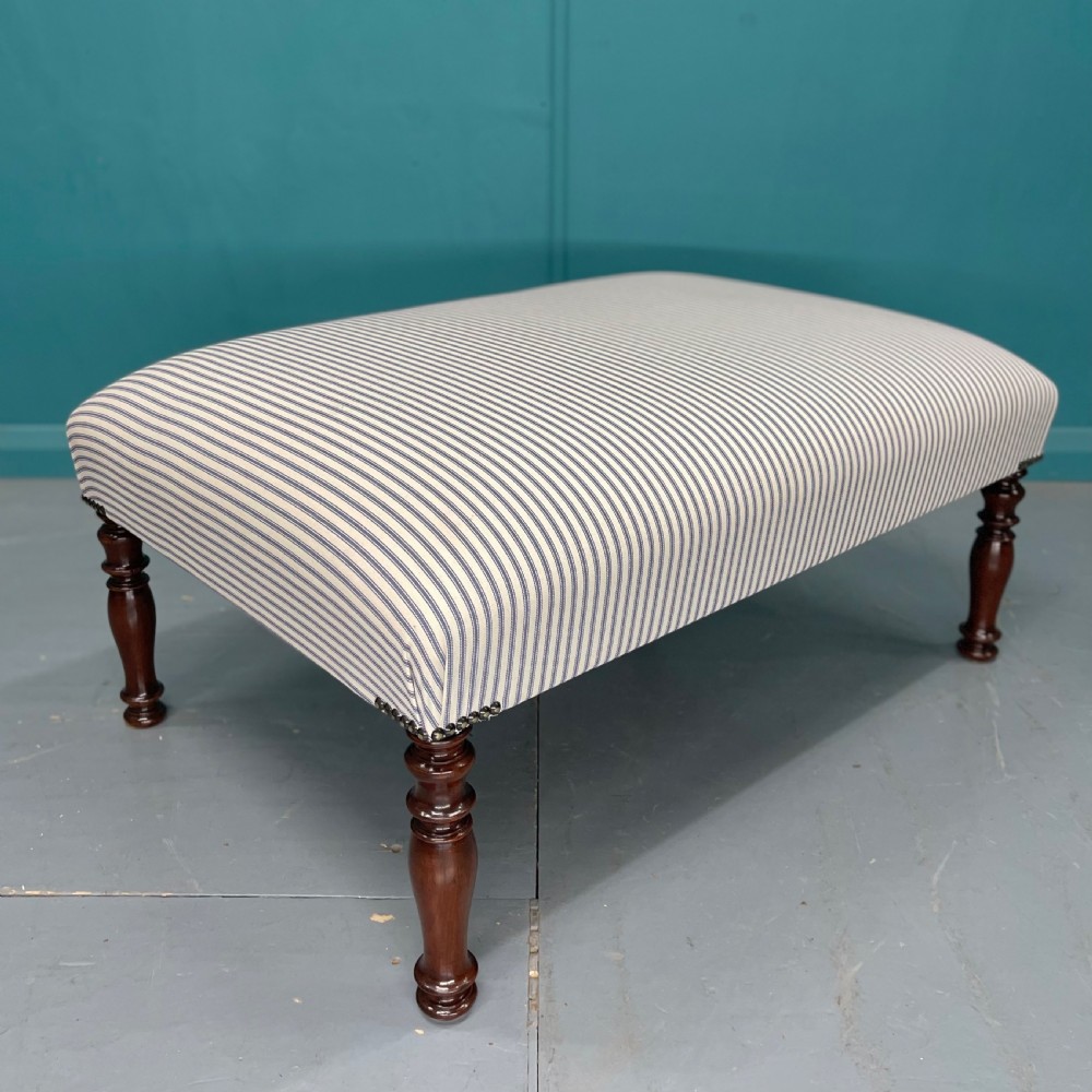 Newly upholstered blue ticking stripe footstool View II