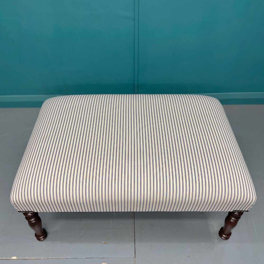 Newly upholstered blue ticking stripe footstool View III