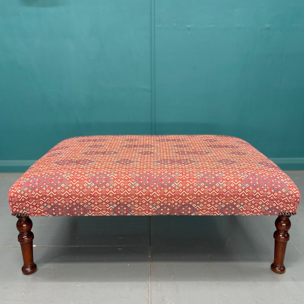 Large newly upholstered geometric print footstool