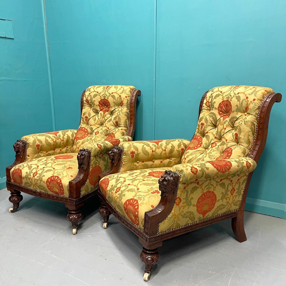 Pair of newly upholstered buttoned library armchairs 