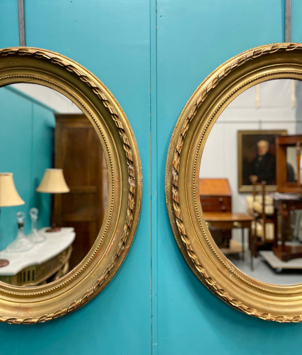 Large pair of French oval gilt mirrors View II
