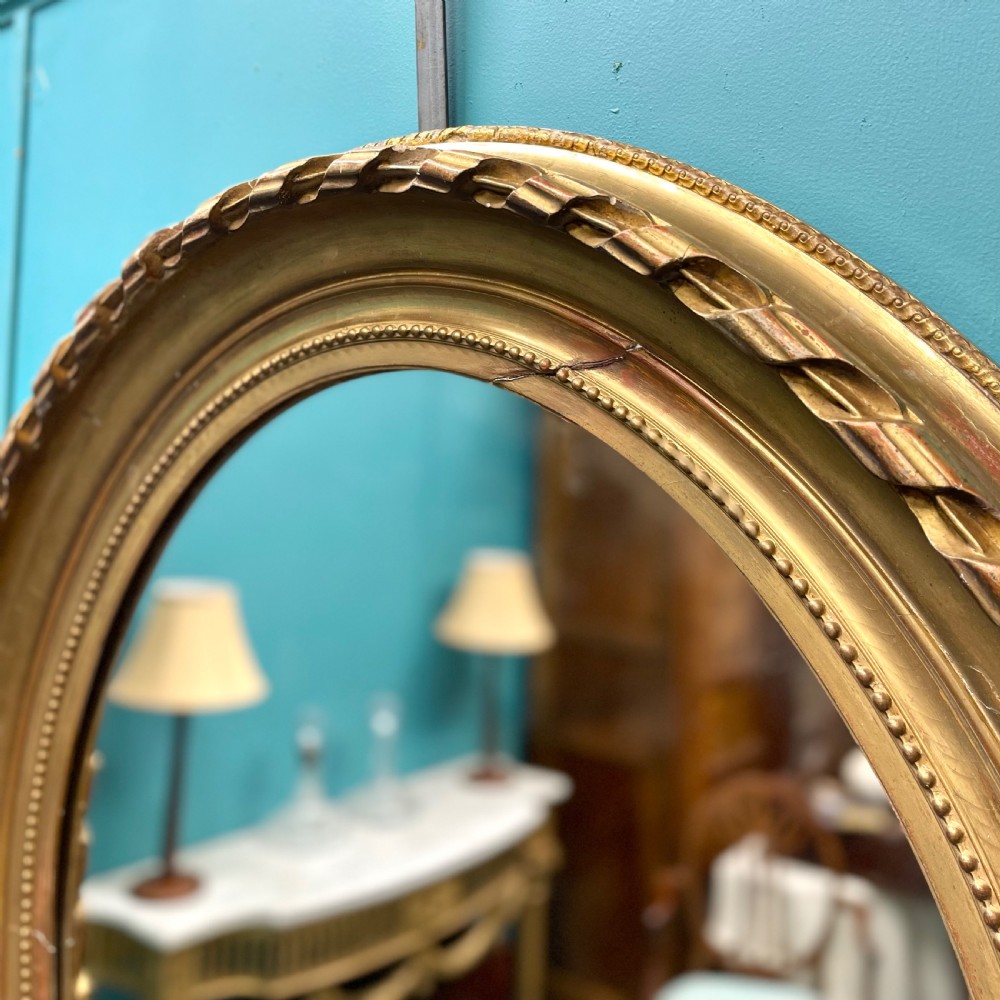 Large pair of French oval gilt mirrors View VII