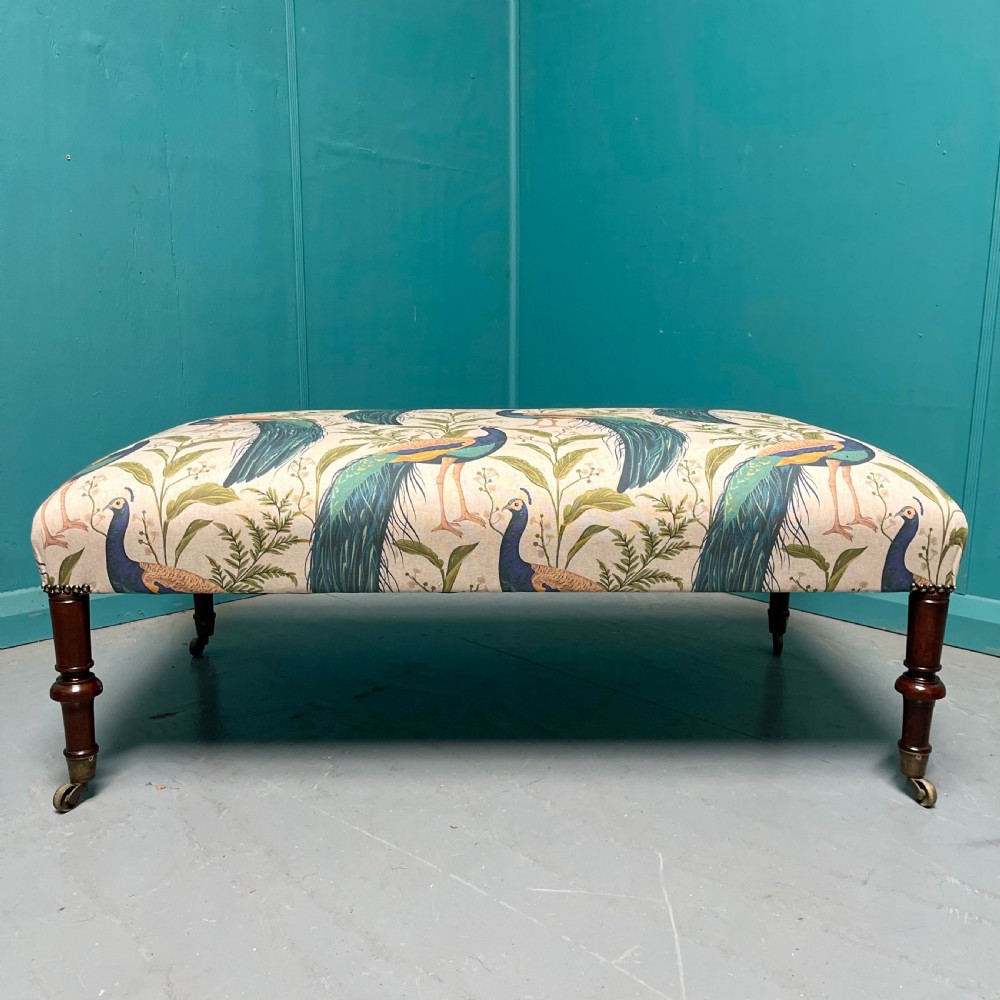 Newly upholstered peacocks centre footstool View II
