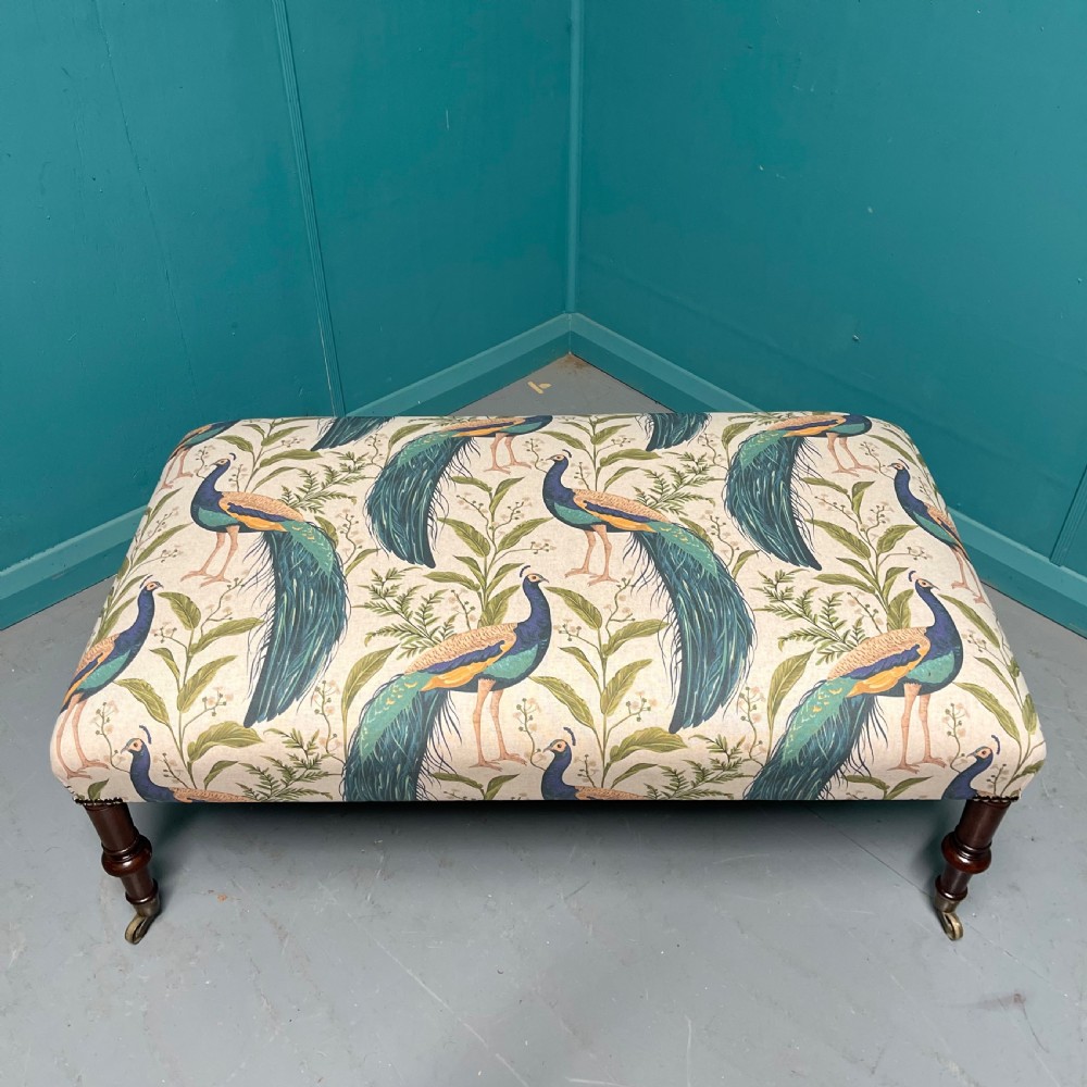 Newly upholstered peacocks centre footstool View IV