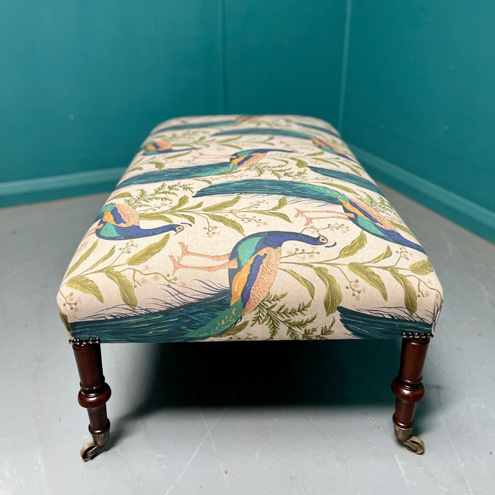 Newly upholstered peacocks centre footstool View VI