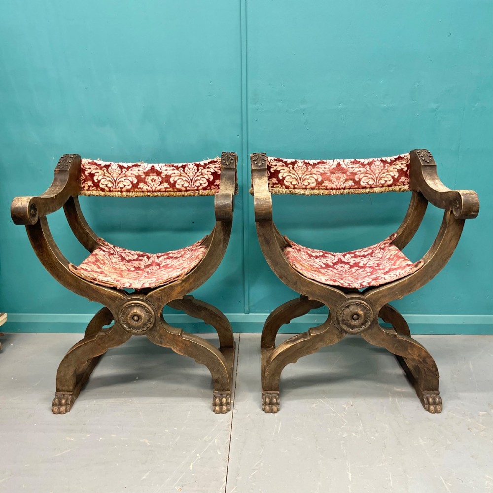 Pair of Spanish X frame hip joint hall chairs