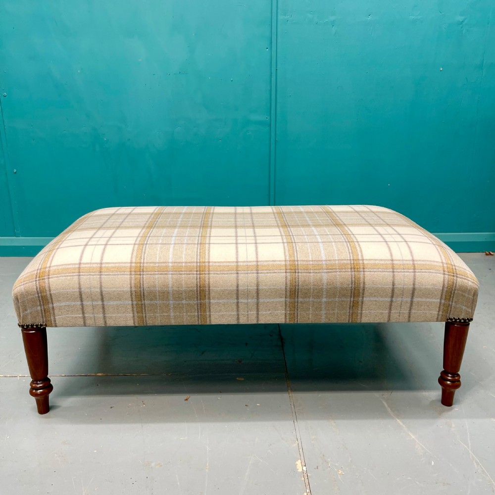 Newly upholstered Harris tartan plaid footstool