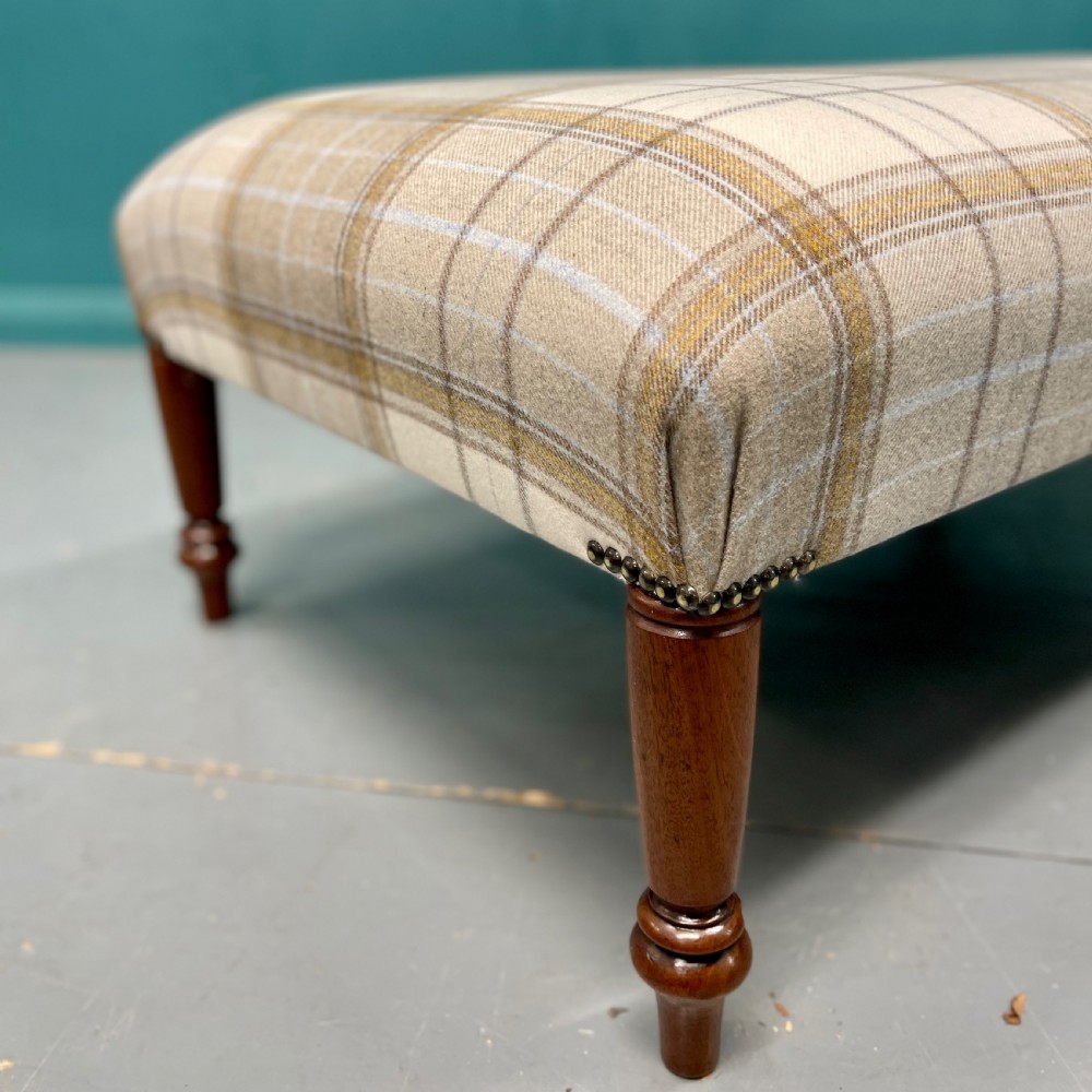 Newly upholstered Harris tartan plaid footstool View III