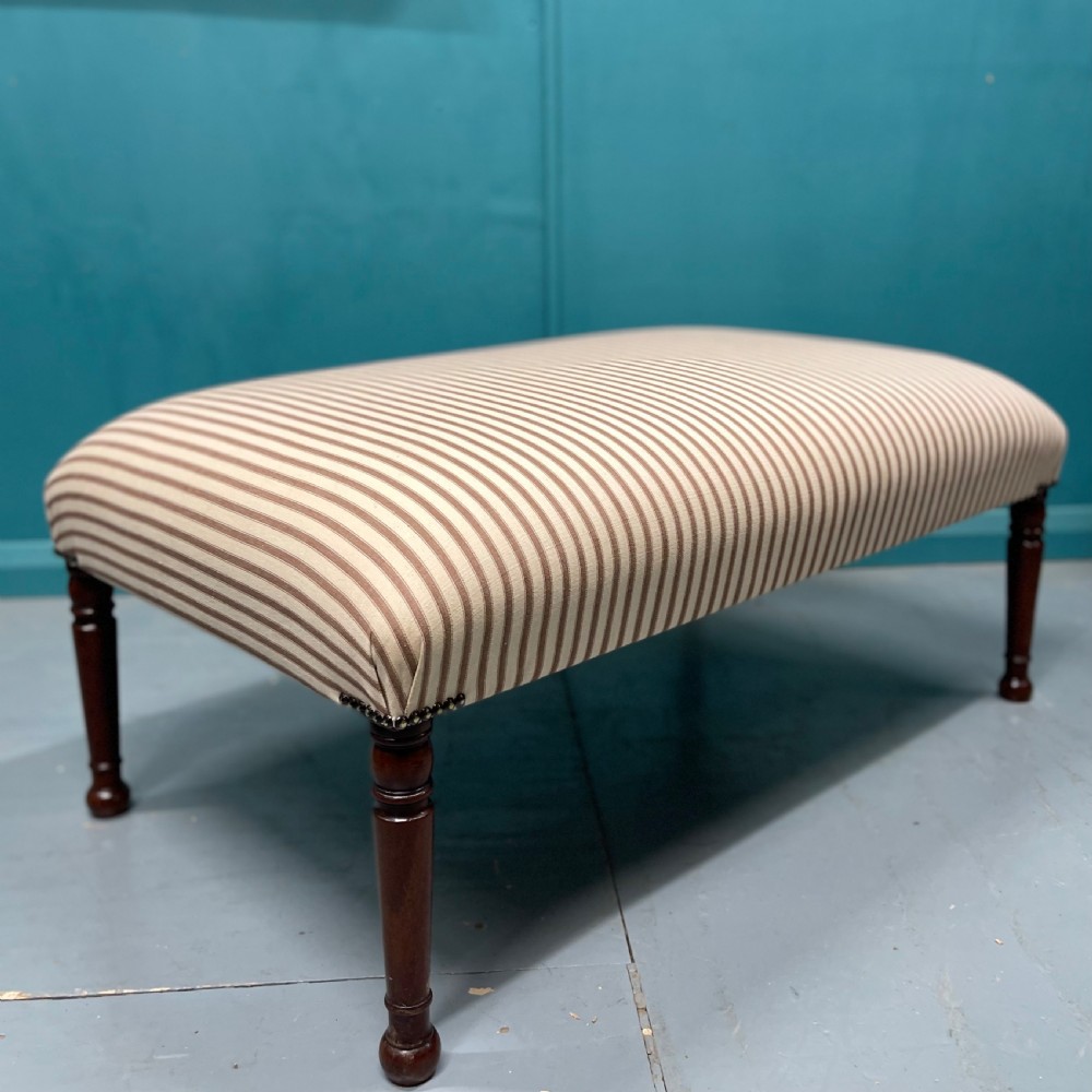 Newly upholstered wide ticking stripe ottoman footstool