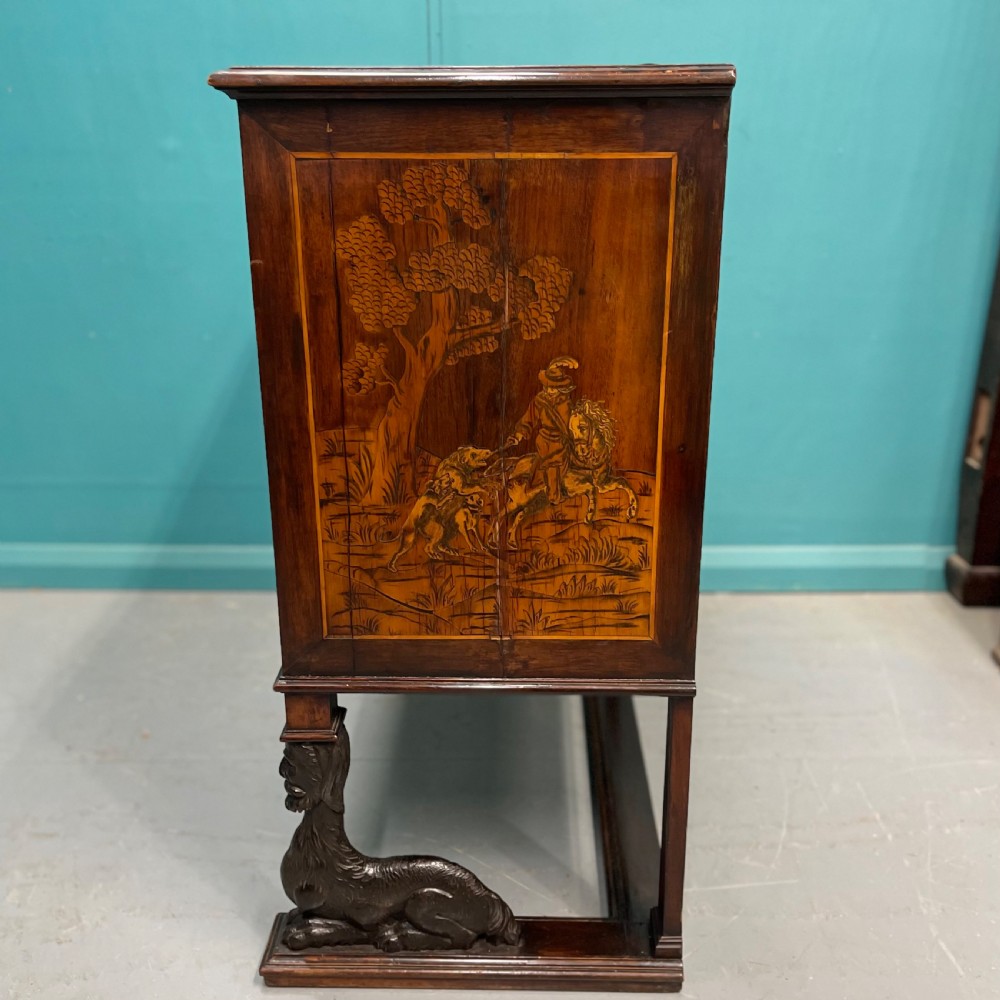 A nineteenth-century Italian walnut chest featuring three drawers decorated with detailed marquetry pictorial scenes and resting on carved base supports. View VIII
