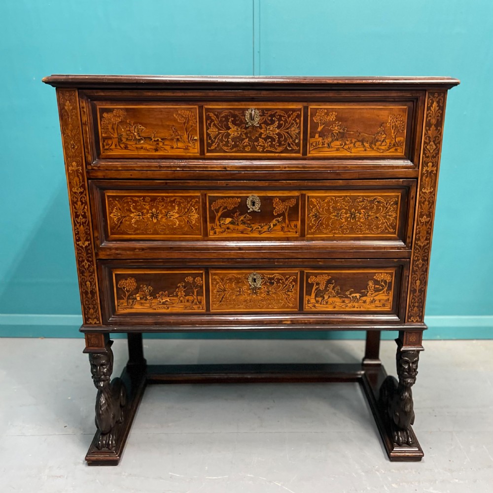 A nineteenth-century Italian walnut chest featuring three drawers decorated with detailed marquetry pictorial scenes and resting on carved base supports. View IX