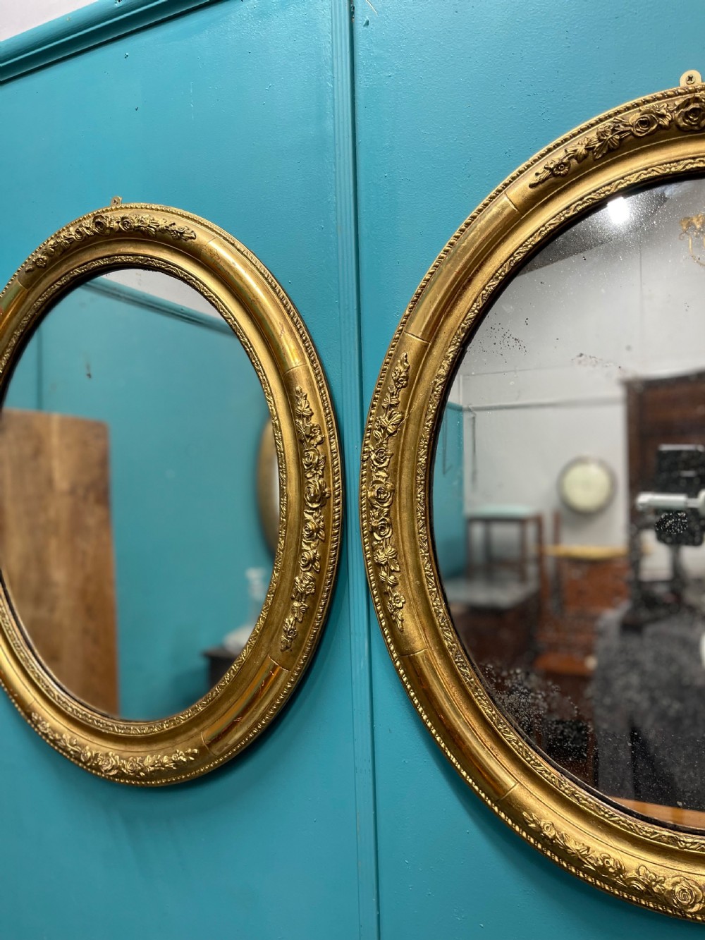 Large pair of French oval gilt mirrors View III
