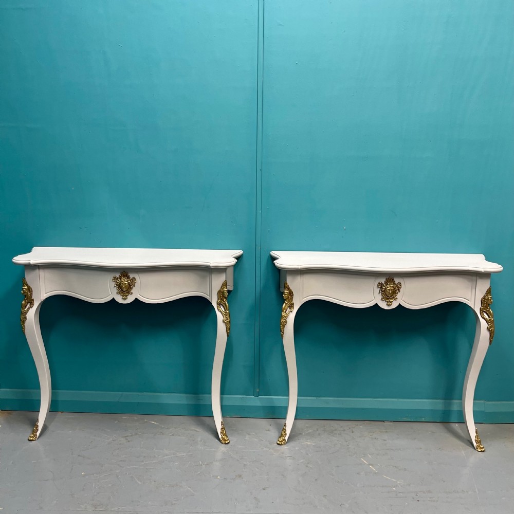 Pair of French painted console tables with mounts