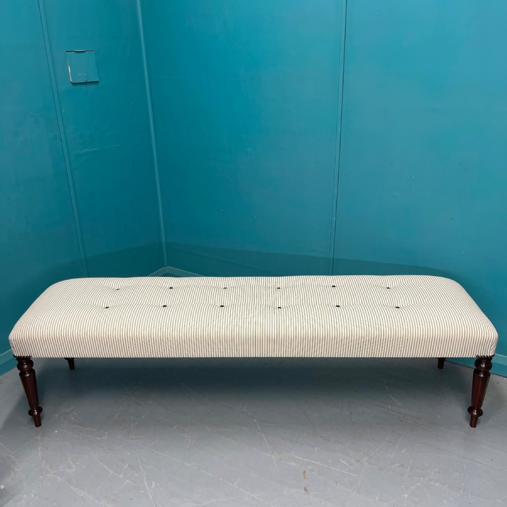 Newly upholstered 6 foot long stool in buttoned ticking View II