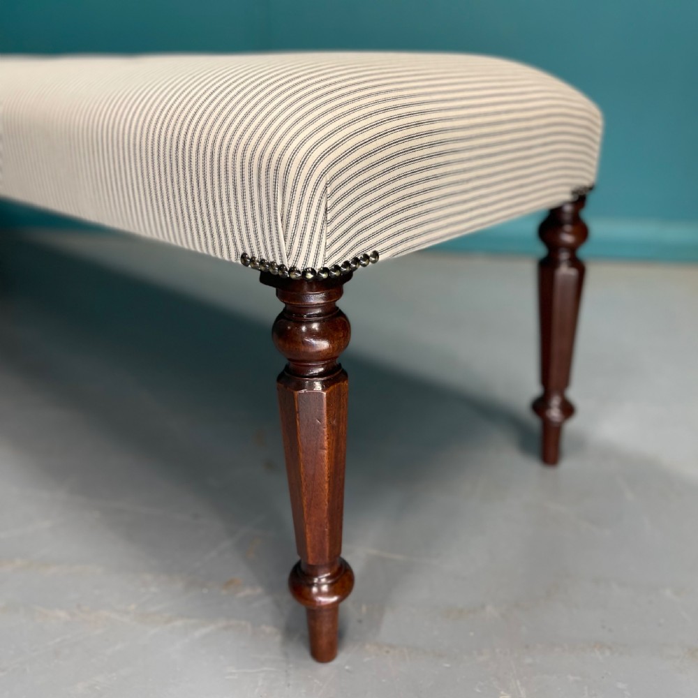 Newly upholstered 6 foot long stool in buttoned ticking View V