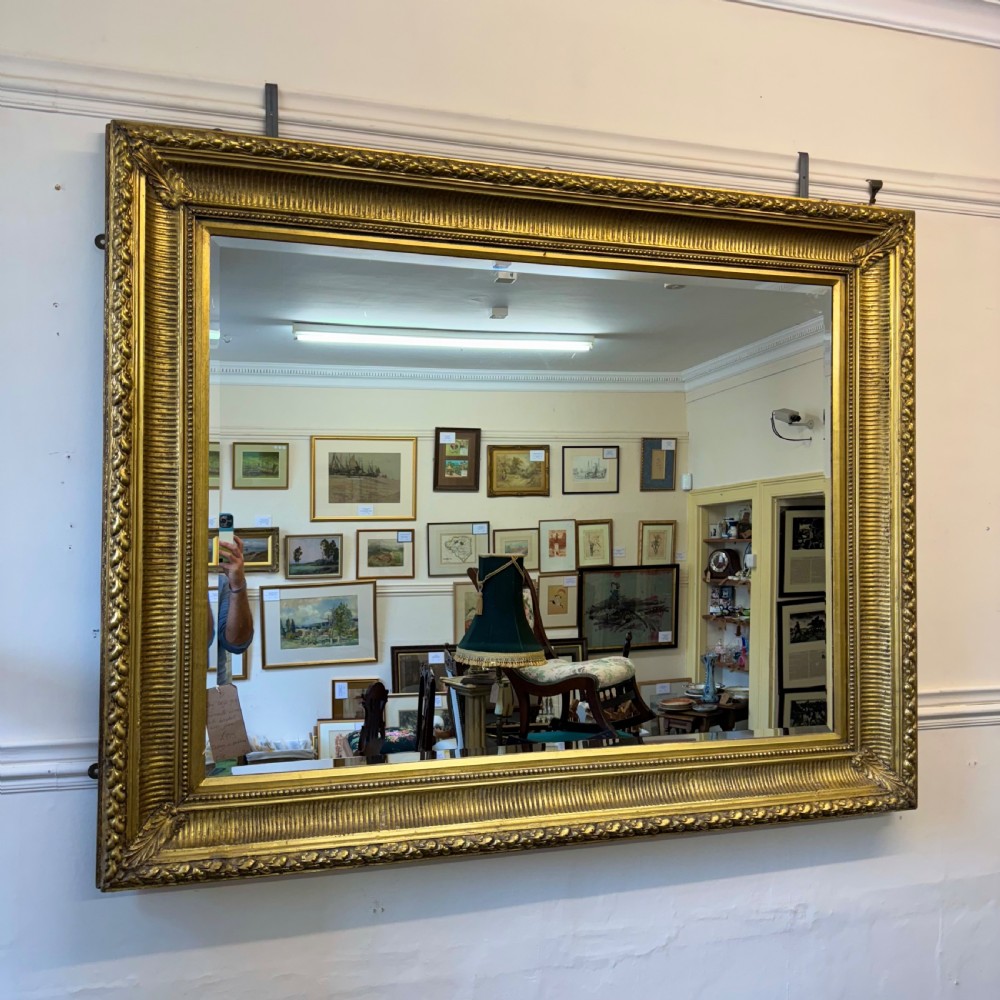 Large English gilt overmantle bevelled mirror