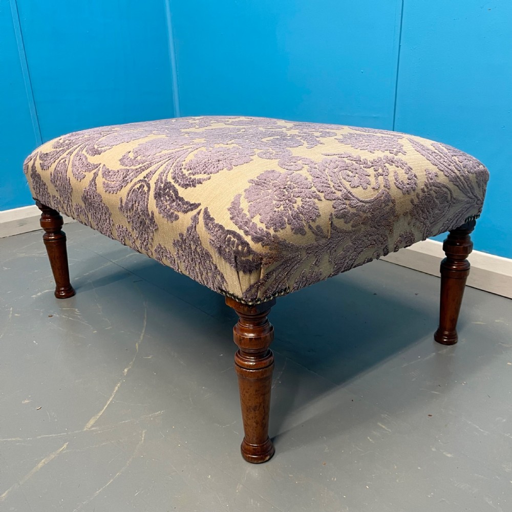 Footstool newly upholstered in mauve velvet pattern