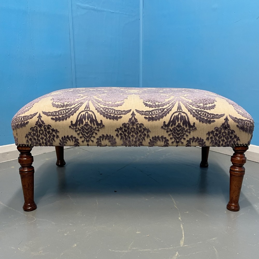 Footstool newly upholstered in mauve velvet pattern View II