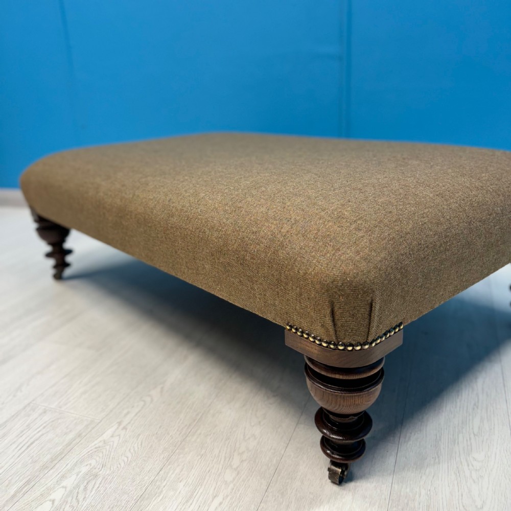Large Harris Tweed footstool on castors View II