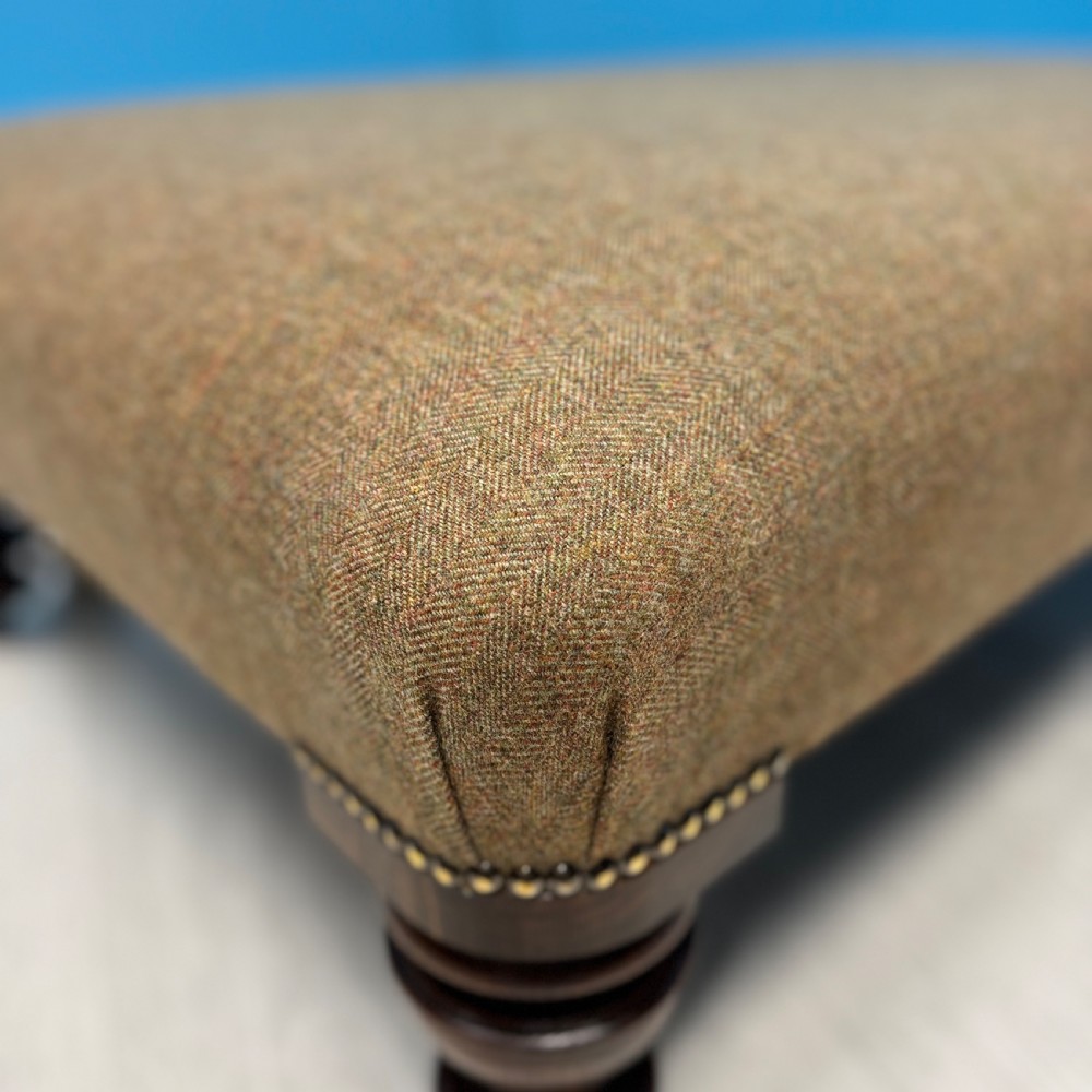 Large Harris Tweed footstool on castors View IV