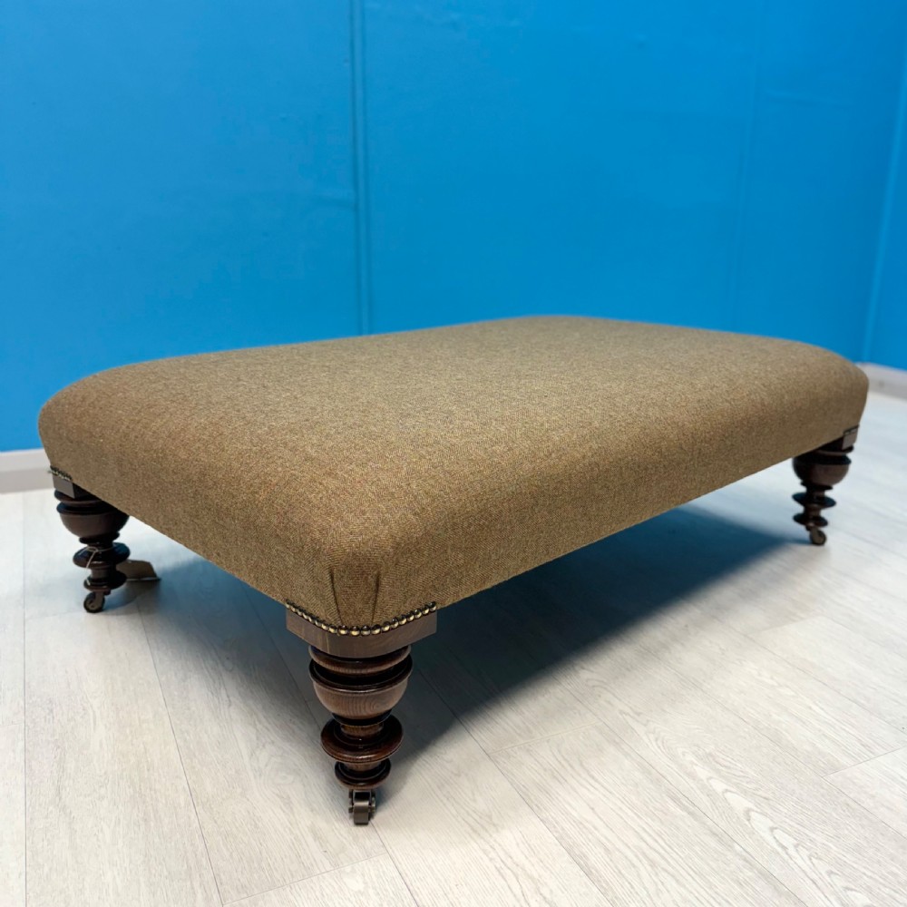 Large Harris Tweed footstool on castors View VI