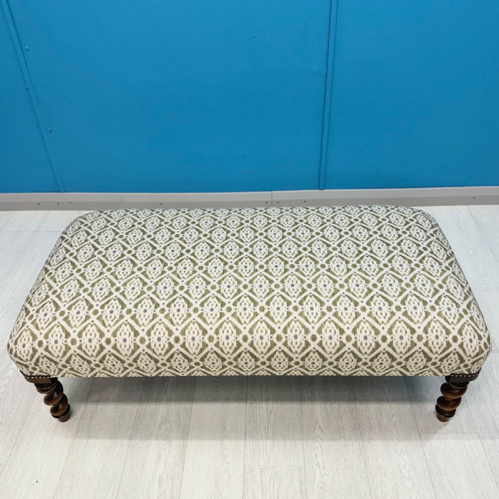 Newly upholstered barley twist footstool View II
