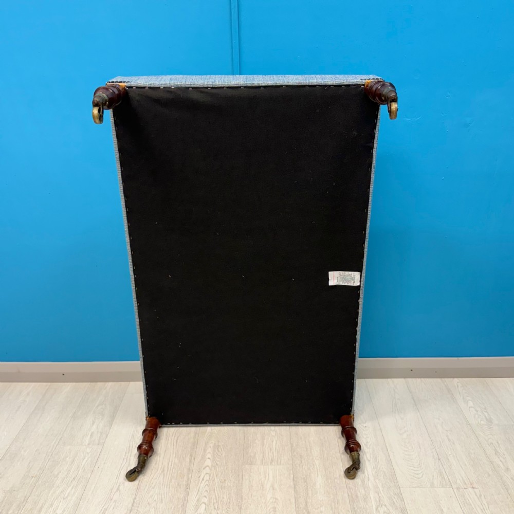 Large newly upholstered footstool on Regency legs with castors  View VII