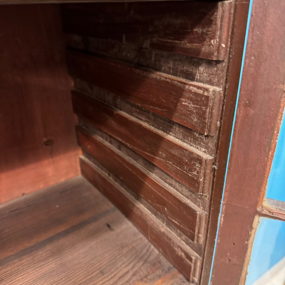 An antique Regency flame mahogany two-part bookcase featuring a glazed upper section with astragal bars and a double cupboard base. View XII