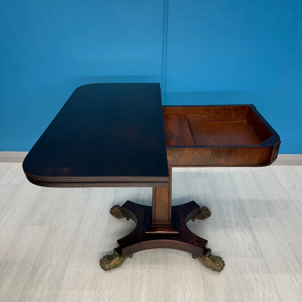 Regency rosewood card table on brass lions paw feet View V