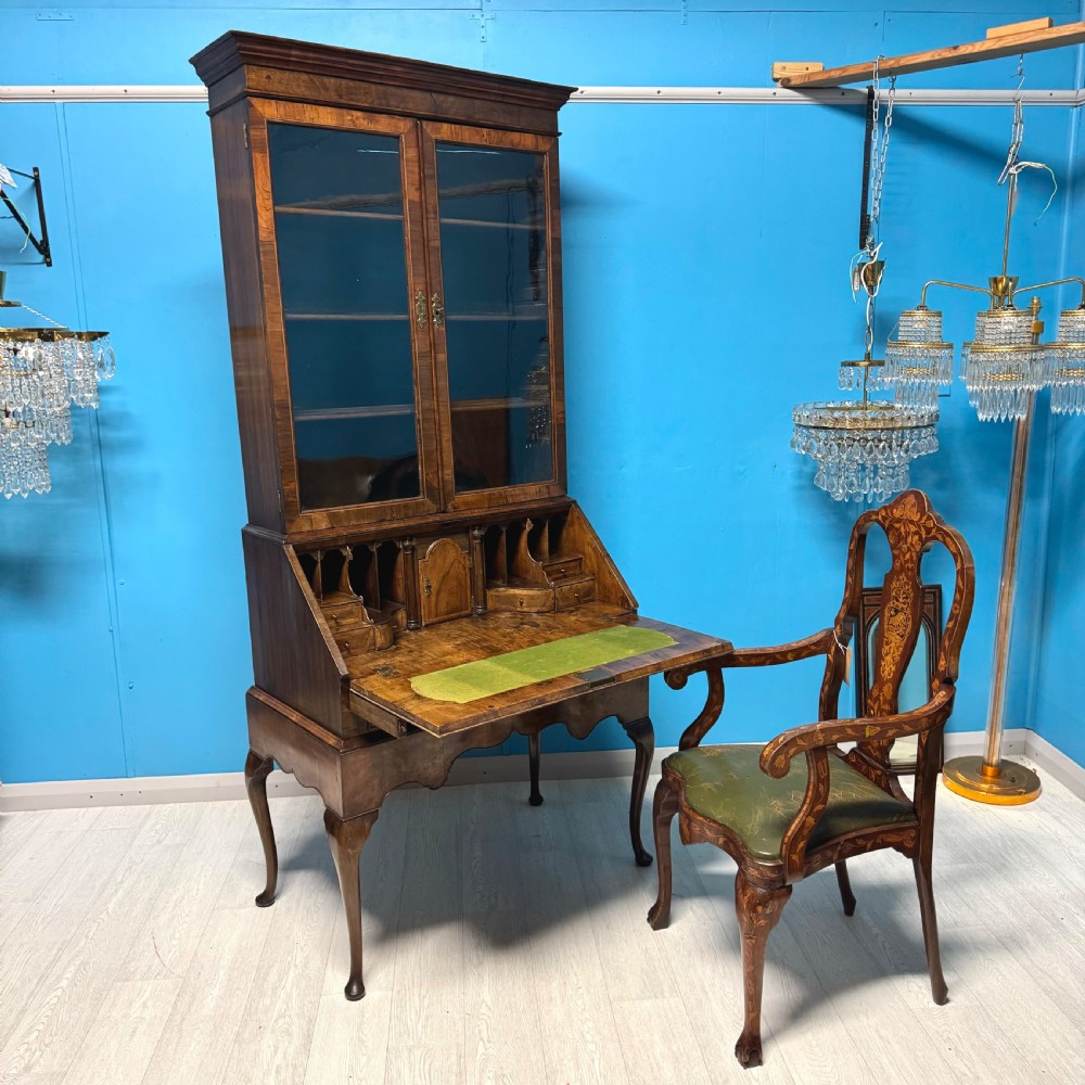 A George II walnut bureau bookcase on stand featuring a two-door glazed upper display cabinet and a slant-front writing desk over cabriole legs. View II