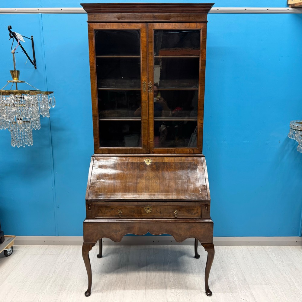 A George II walnut bureau bookcase on stand featuring a two-door glazed upper display cabinet and a slant-front writing desk over cabriole legs. View III