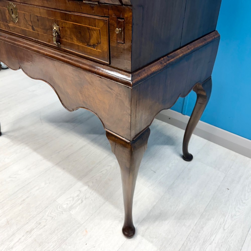 A George II walnut bureau bookcase on stand featuring a two-door glazed upper display cabinet and a slant-front writing desk over cabriole legs. View IX