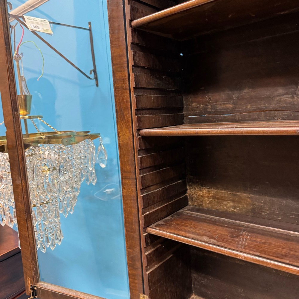 A George II walnut bureau bookcase on stand featuring a two-door glazed upper display cabinet and a slant-front writing desk over cabriole legs. View XIII