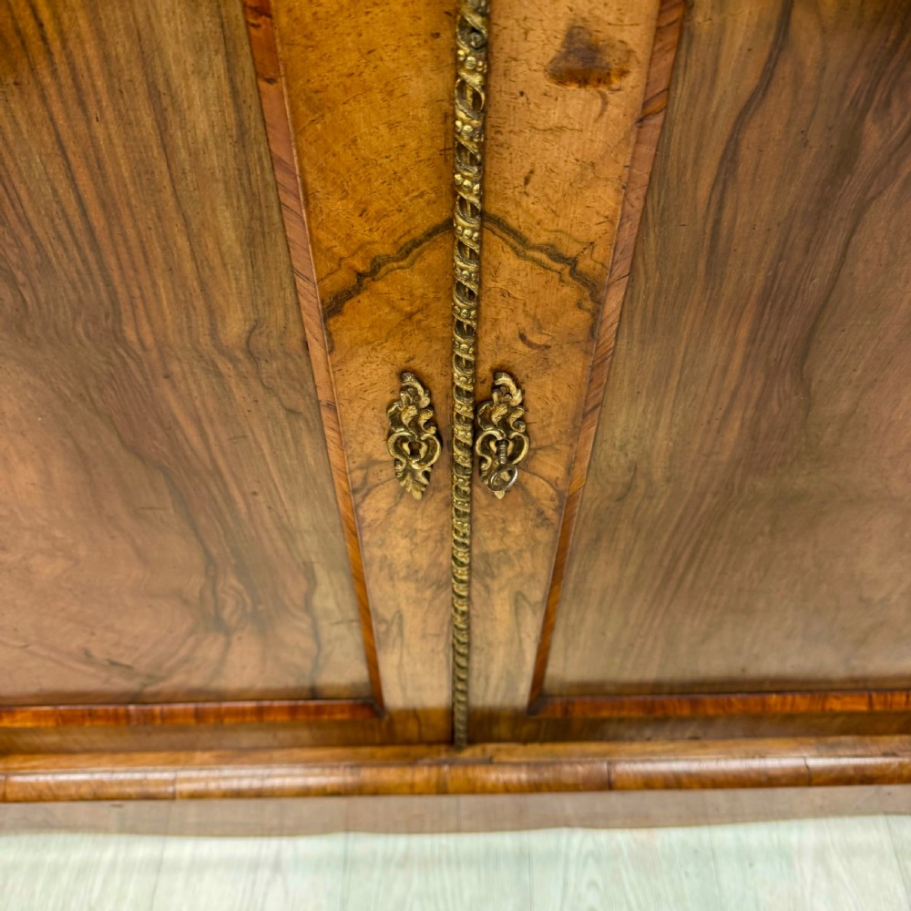 Outstanding quality walnut and brass mounted bookcase View VII
