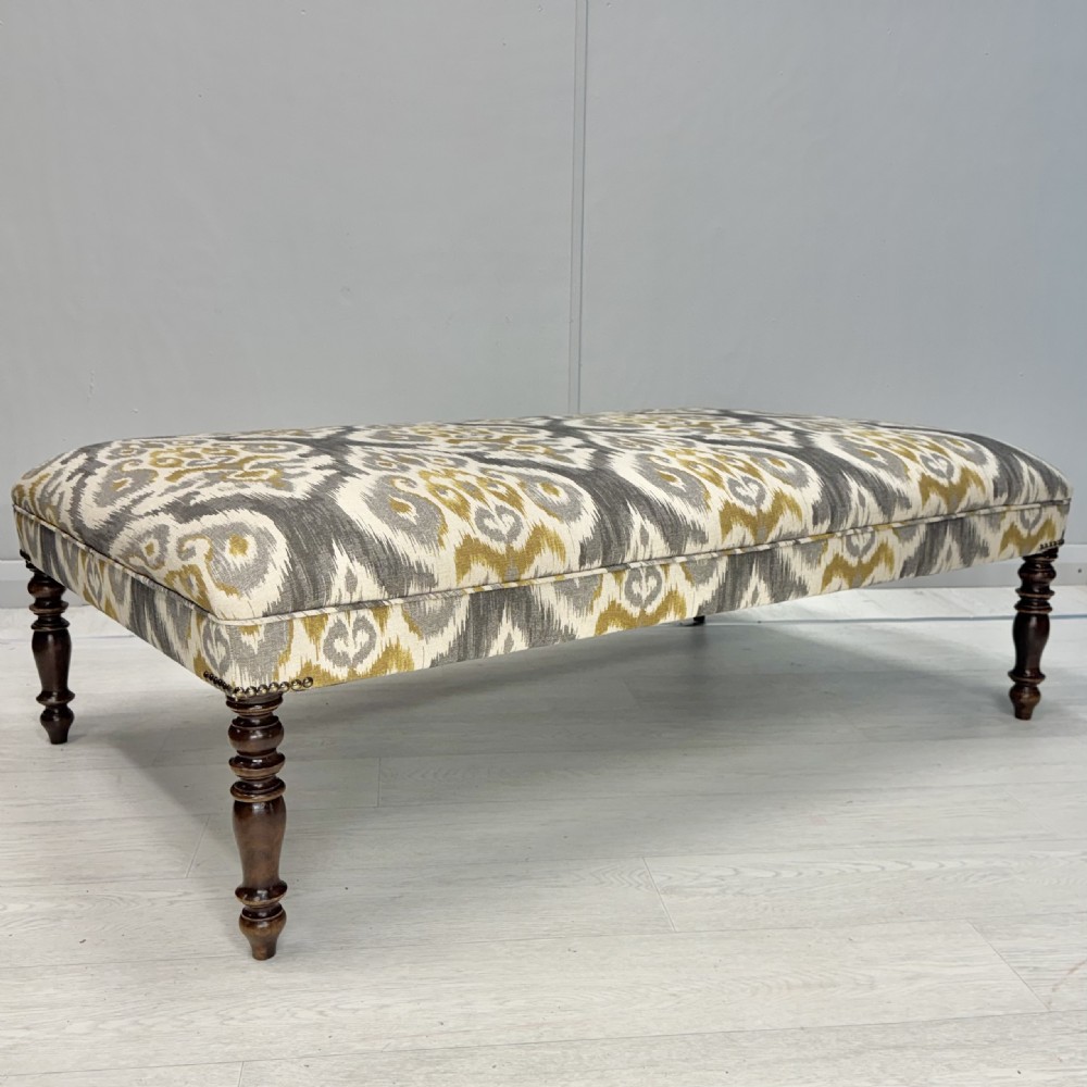 Large newly upholstered Regency footstool