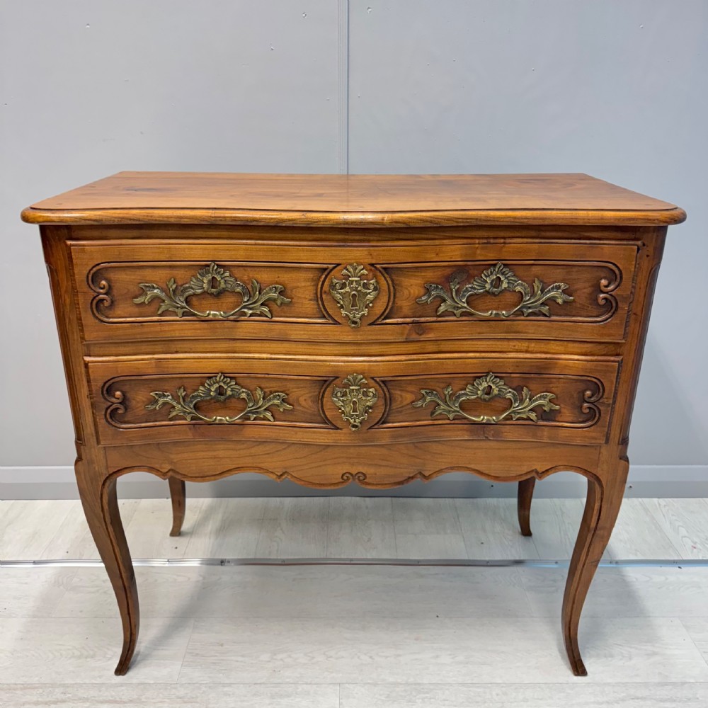 French serpentine chest of drawers in cherry wood