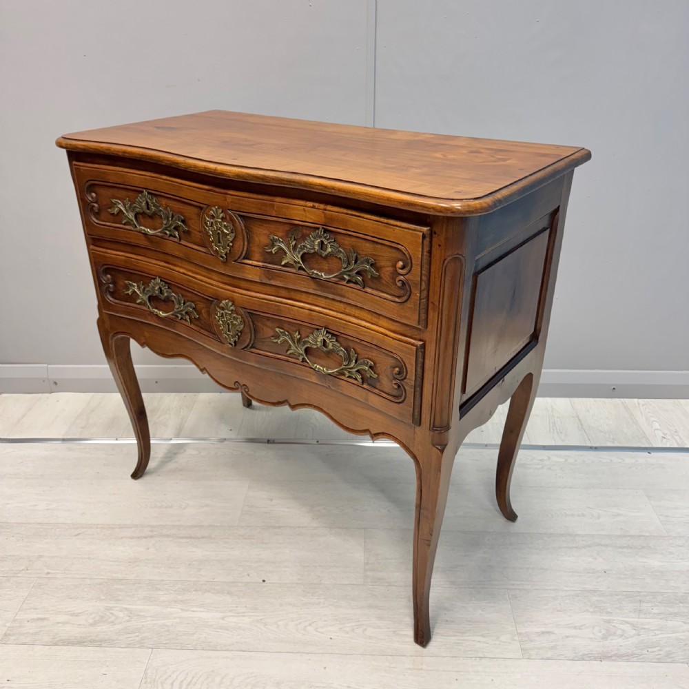 French serpentine chest of drawers in cherry wood View II