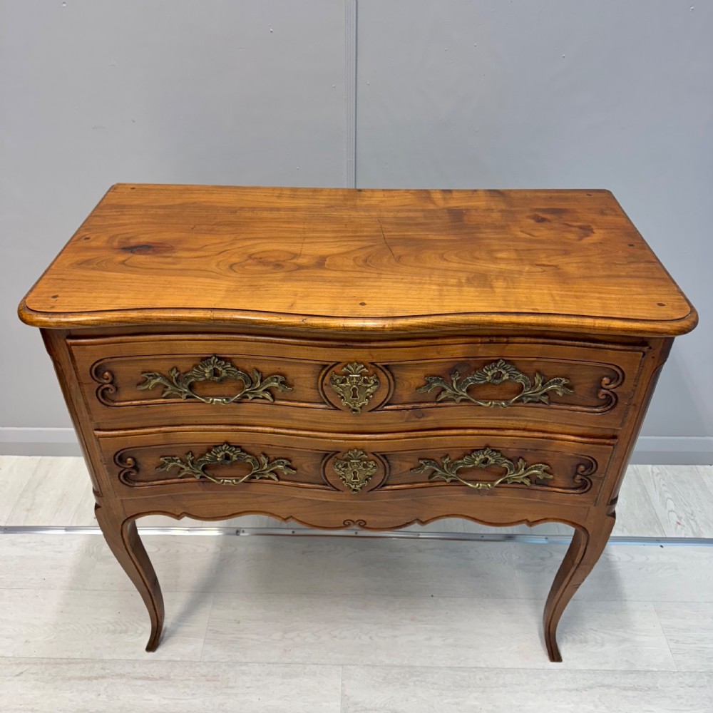 French serpentine chest of drawers in cherry wood View III