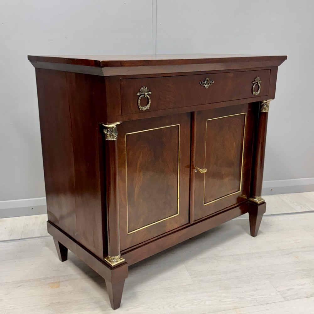 French Empire mahogany and brass inlaid cabinet