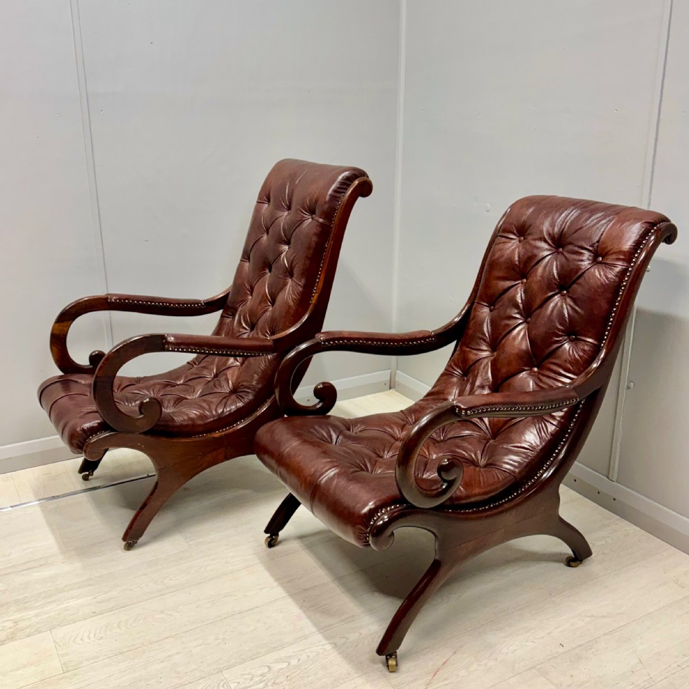 Near pair of Gillows “Spanish” leather armchairs