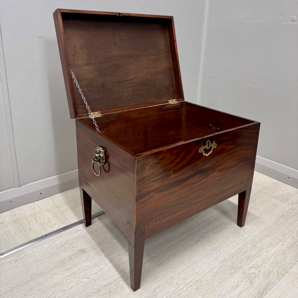 Georgian mahogany cellarette with lions mask