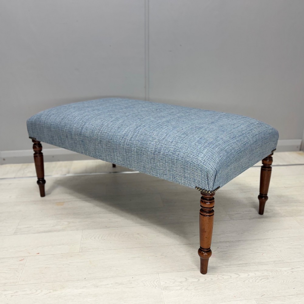 Newly upholstered turned leg footstool 