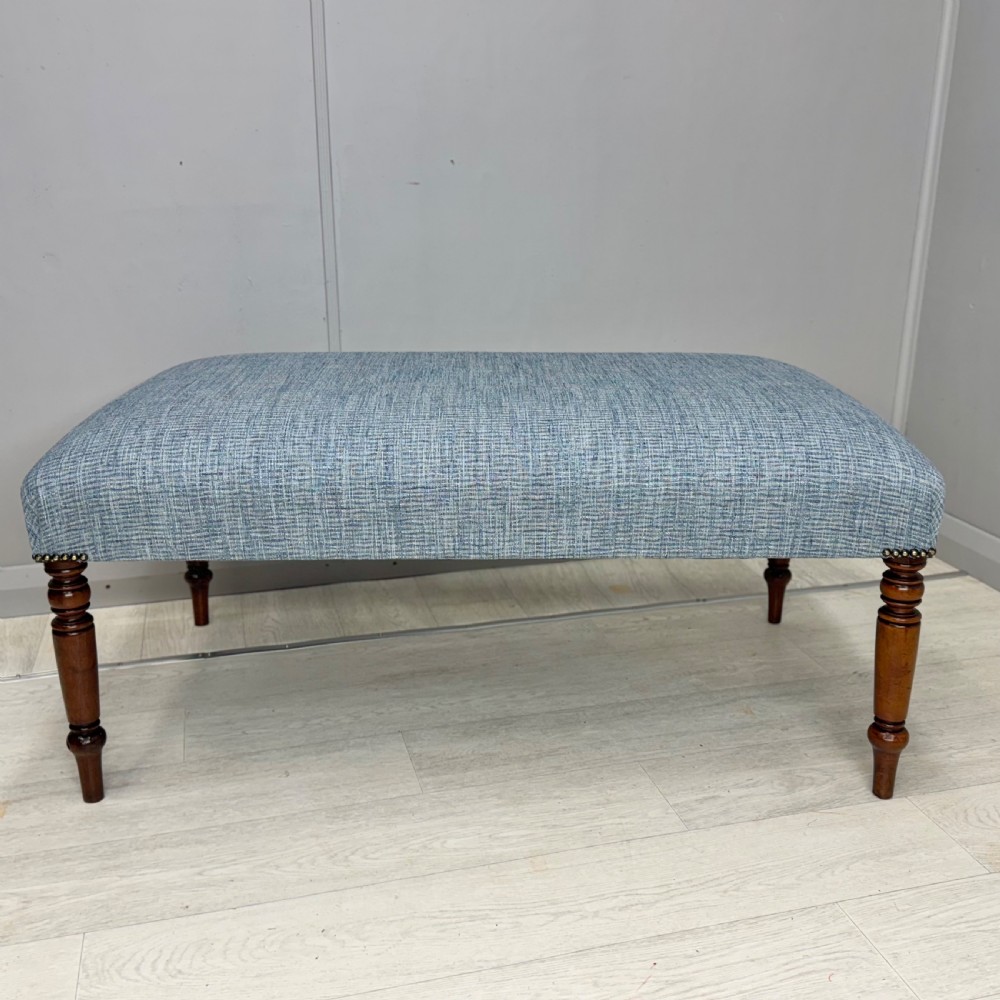 Newly upholstered turned leg footstool  View III