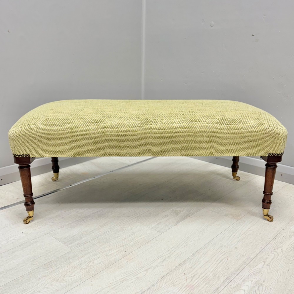 Newly upholstered footstool in Herringbone