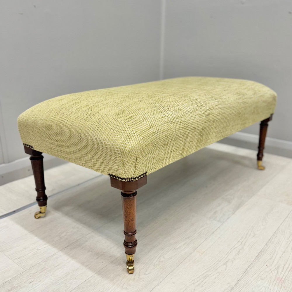 Newly upholstered footstool in Herringbone View III
