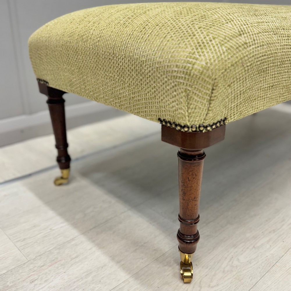 Newly upholstered footstool in Herringbone View IV