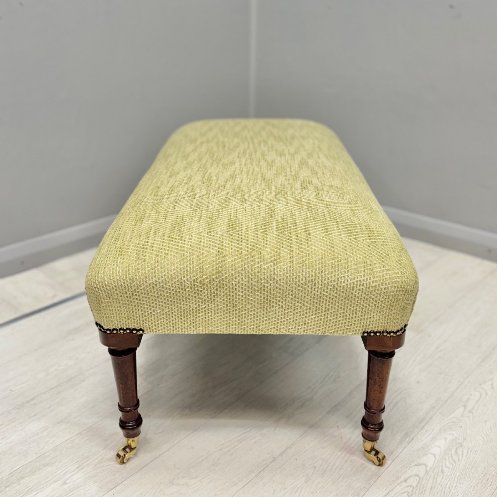 Newly upholstered footstool in Herringbone View V