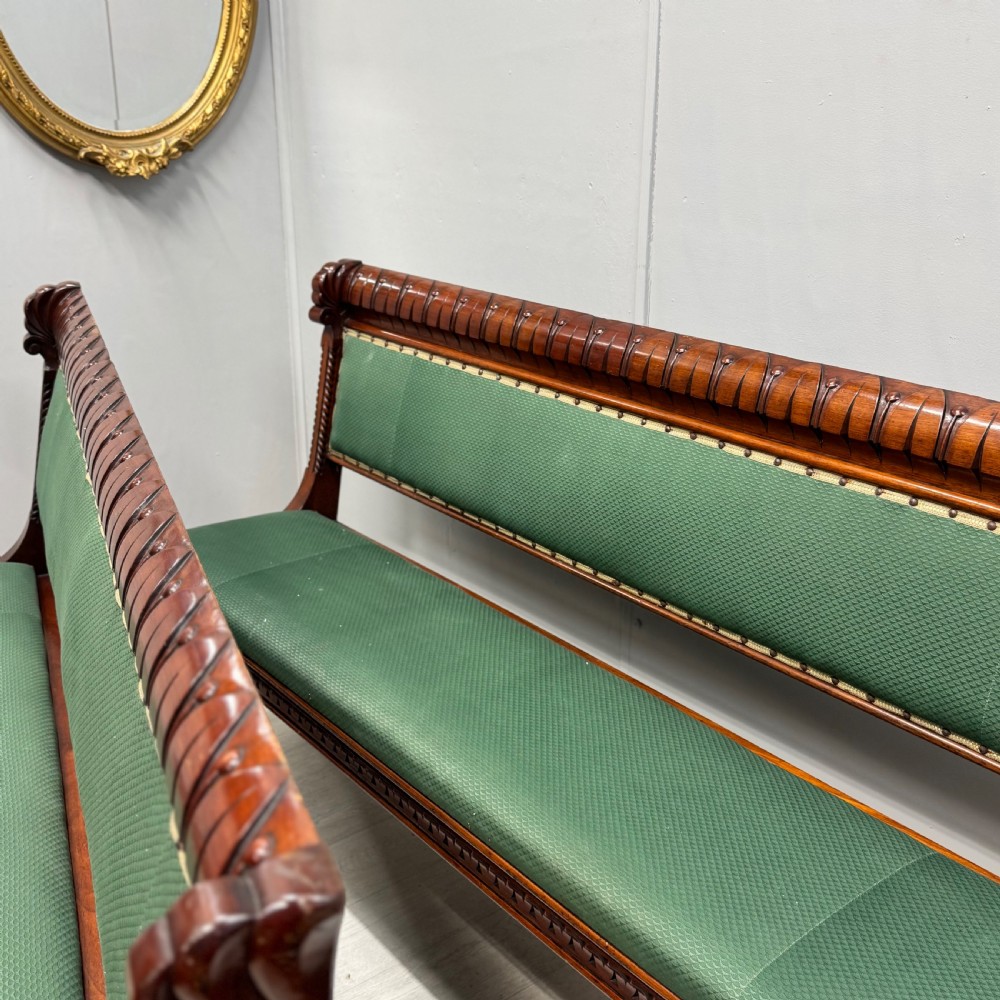 A pair of 19th-century carved mahogany benches featuring green upholstered seats and backrests supported by scrolled legs. View II