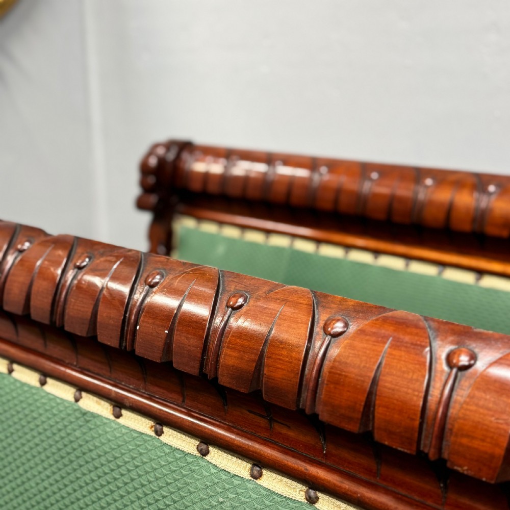 A pair of 19th-century carved mahogany benches featuring green upholstered seats and backrests supported by scrolled legs. View III